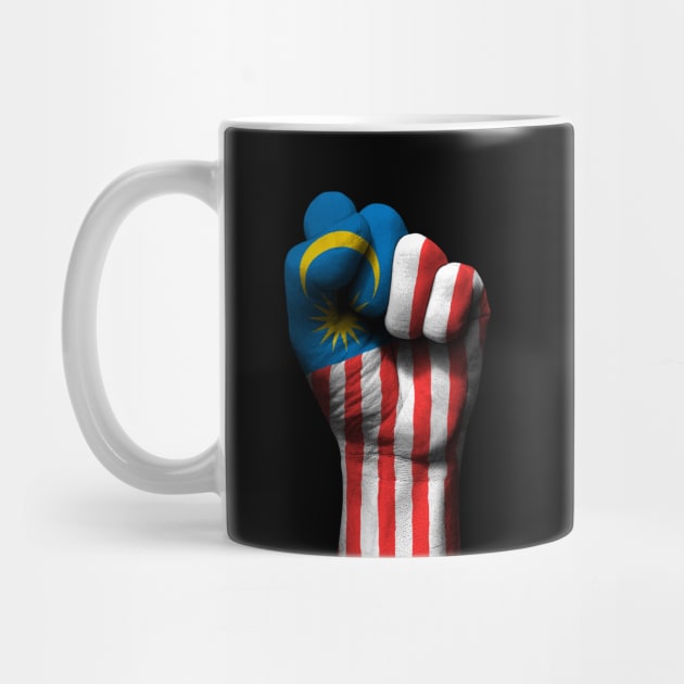 Flag of Malaysia on a Raised Clenched Fist by jeffbartels